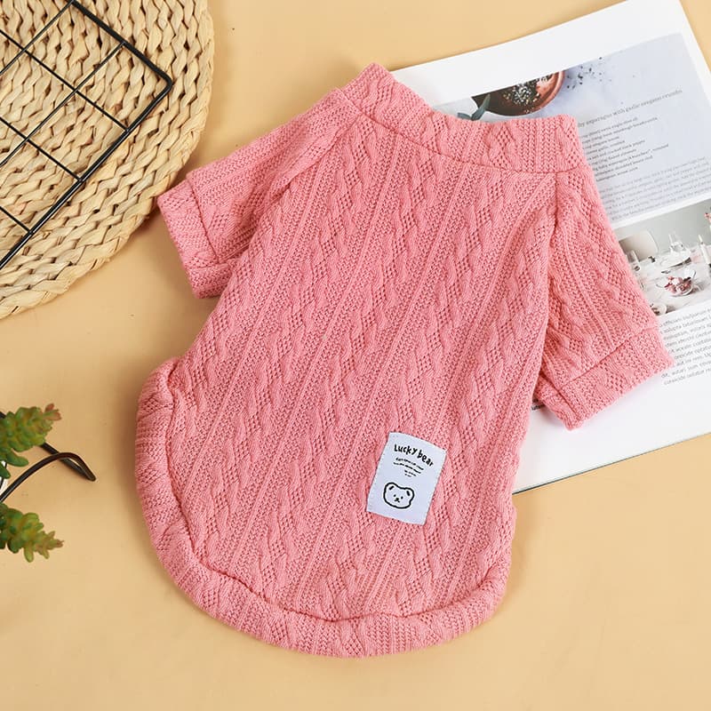 Pink bear knit pet sweater showing cable texture and short sleeves