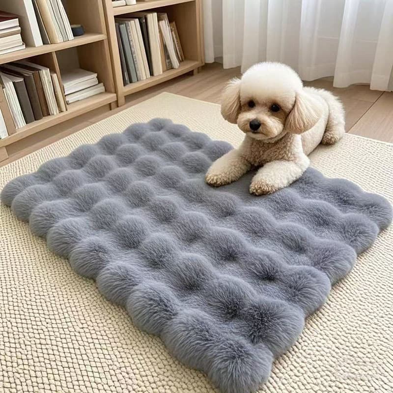 Gray bubble fleece pet cushion mat with a small dog