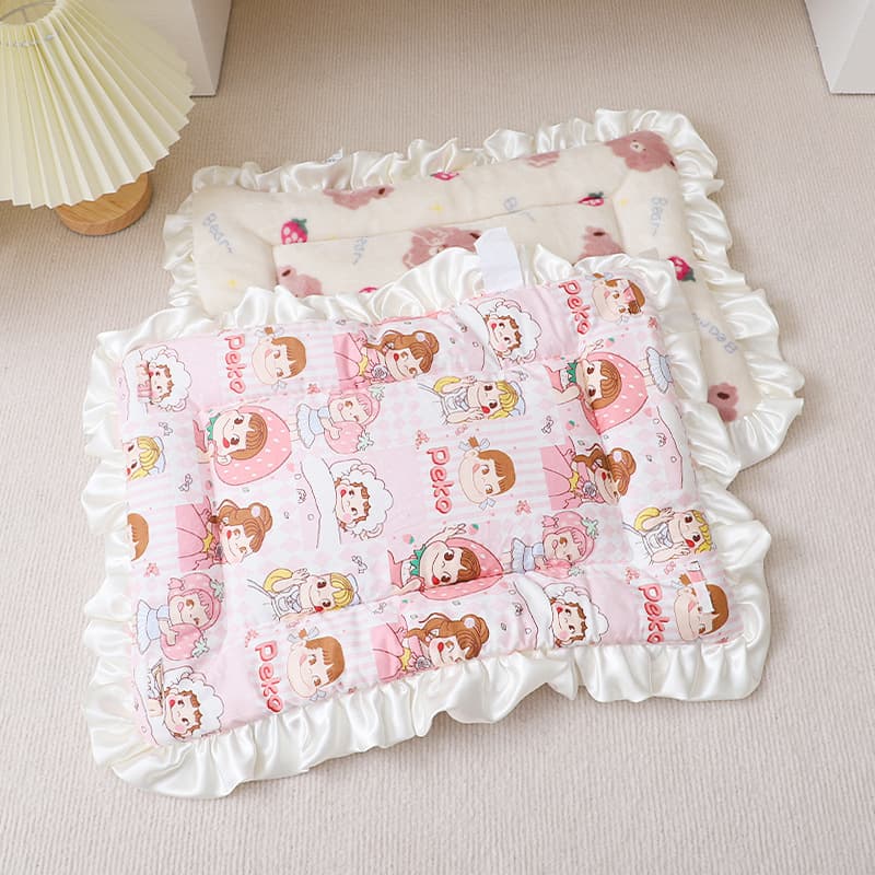 Pink Peko cozy plush pet sleeping mat on a soft floor
