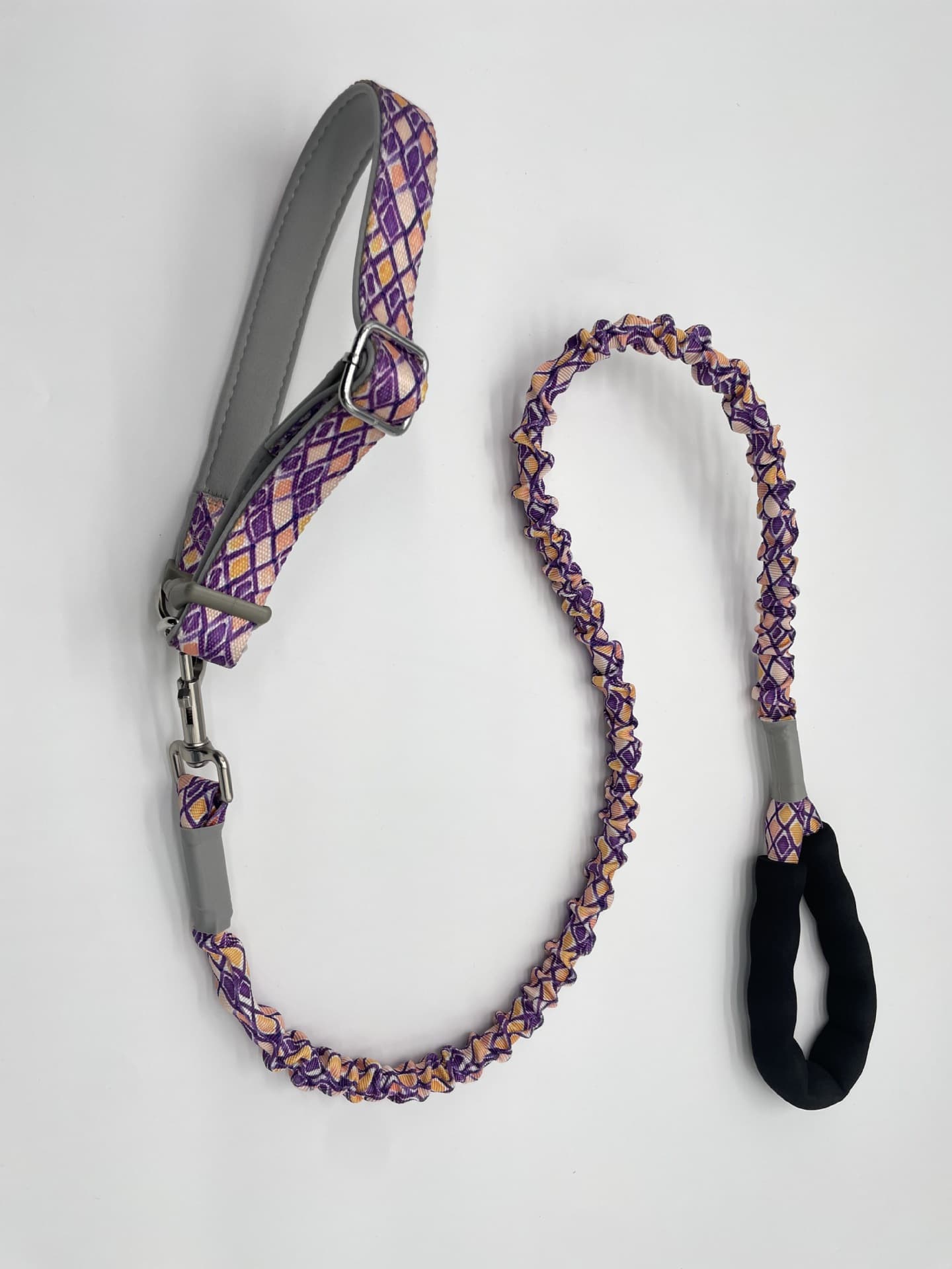 Purple printed bungee dog leash with neck loop and handle